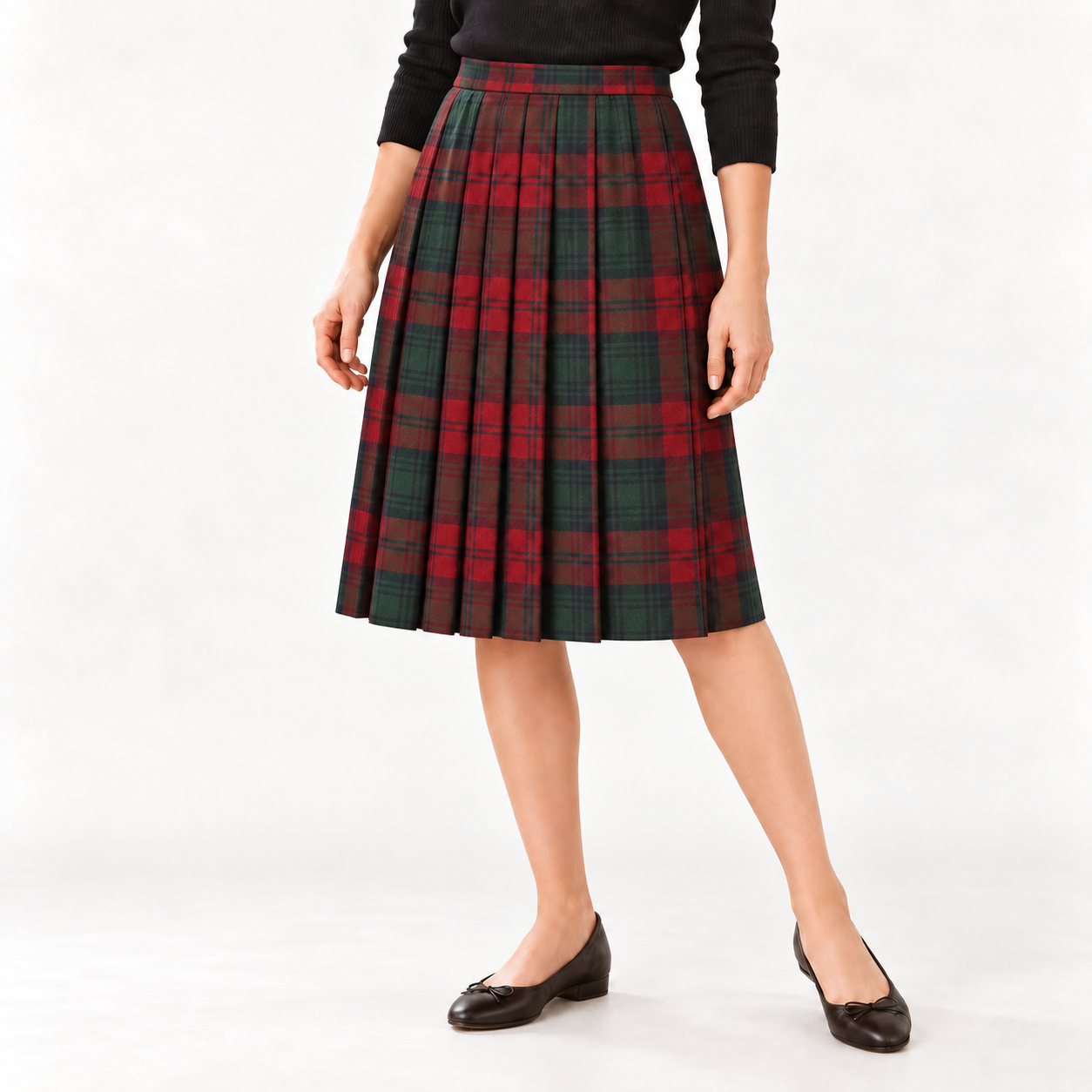 Woman wearing a red and green tartan all-round pleated skirt