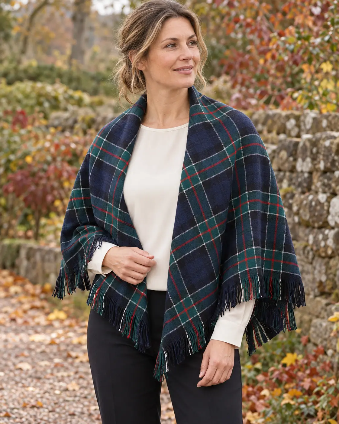 Navy and green tartan shawl with red and white overchecks worn in an autumn garden setting
